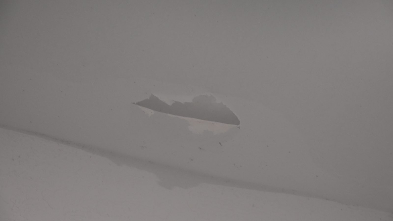 Garage slab crack, close view