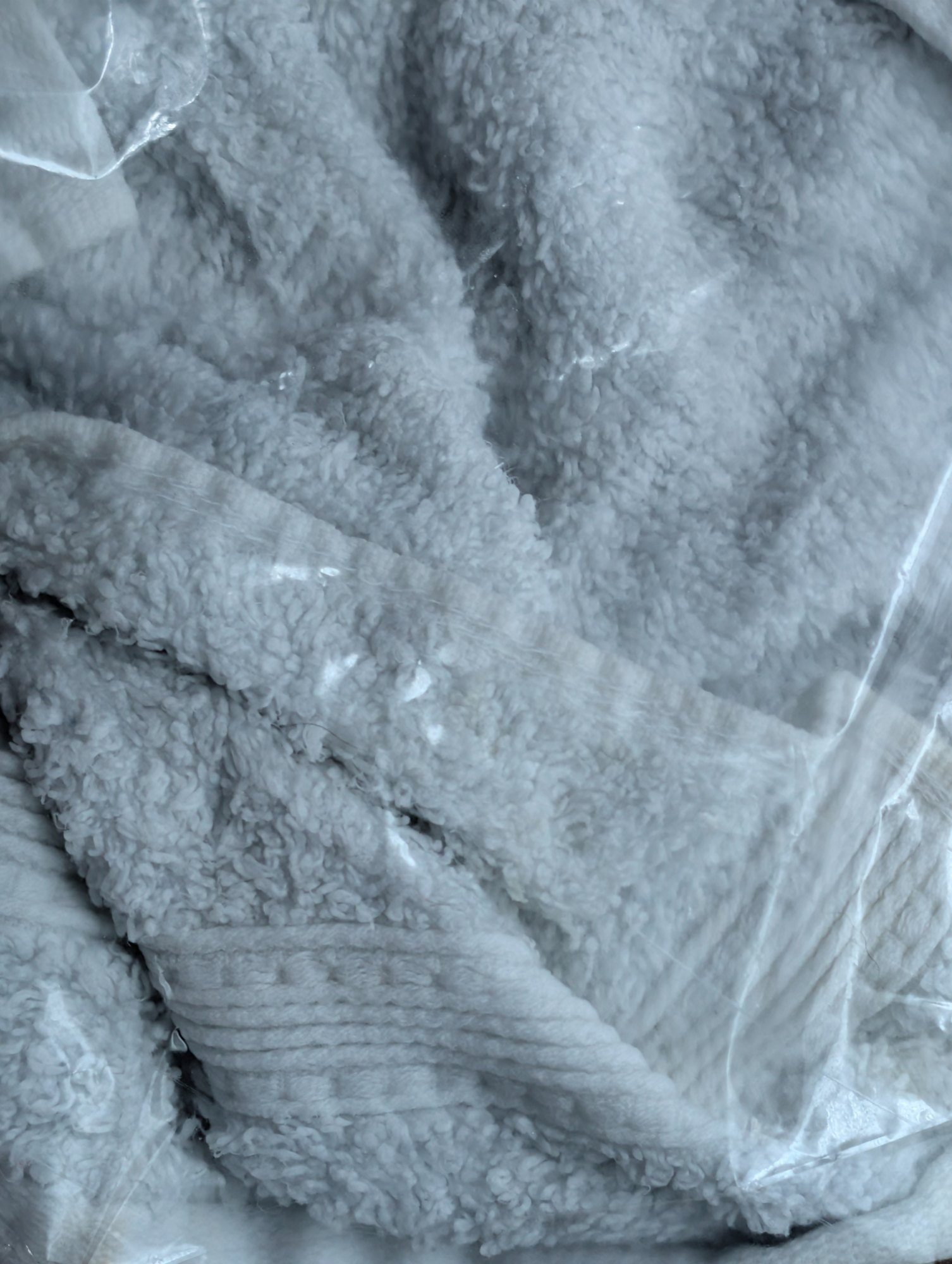 Stained bath towel sealed in a clear plastic bag