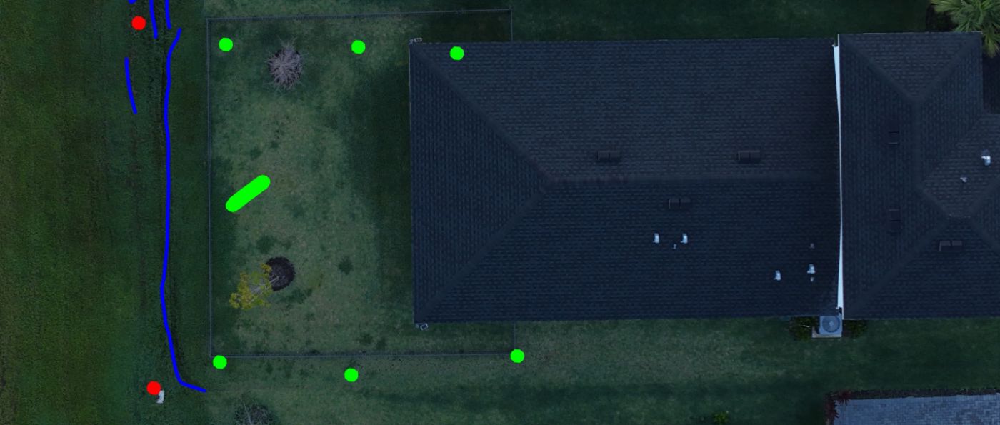 Drone, annotated: fence, inlets, standing water along the rear lot line